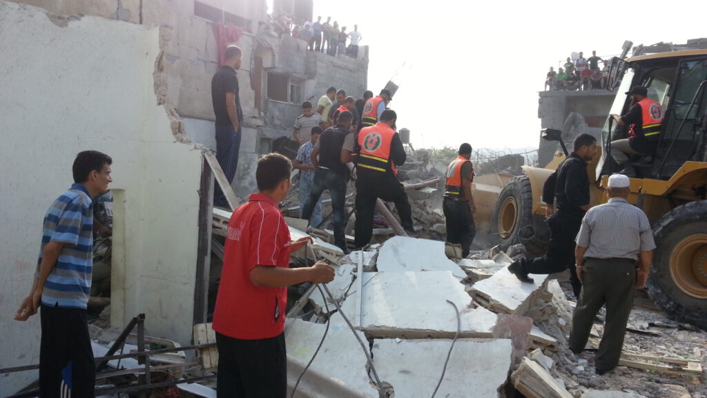 martyrs recovered in Al-Sabra neighborhood; search continues for dozens missing
